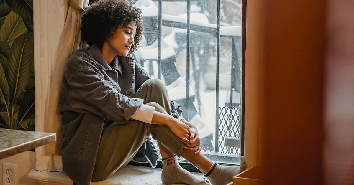 Women sitting in silence sad